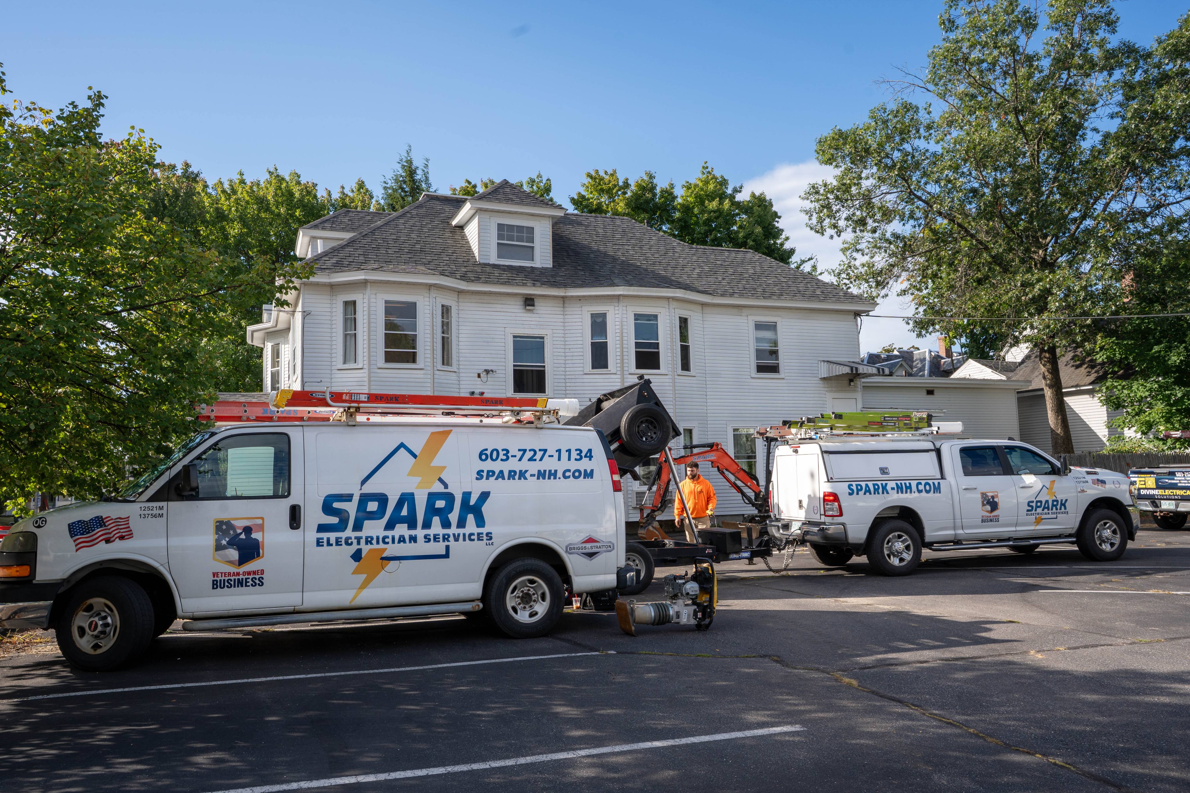 Spark service vehicles on site for an underground electrical installation at 85 Brook St