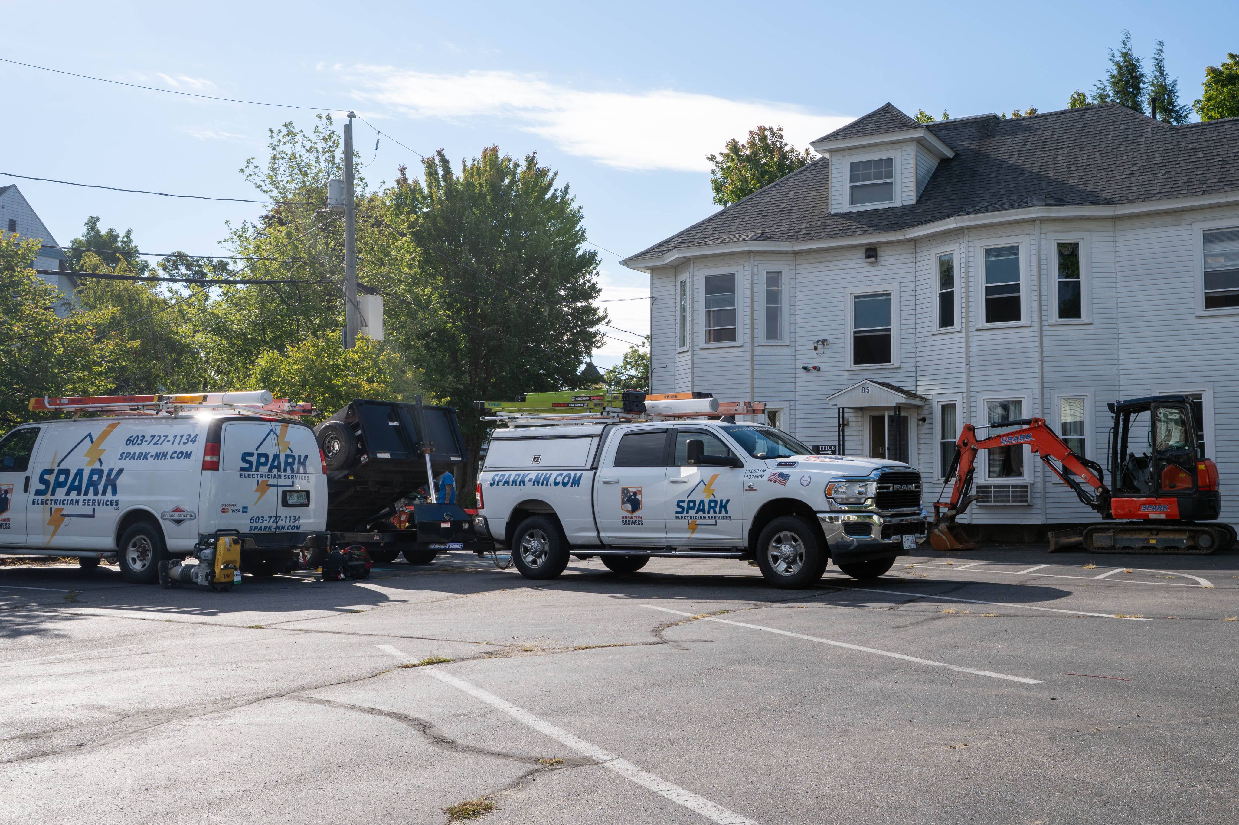 Spark crew and vehicles on site at 85 Brook St