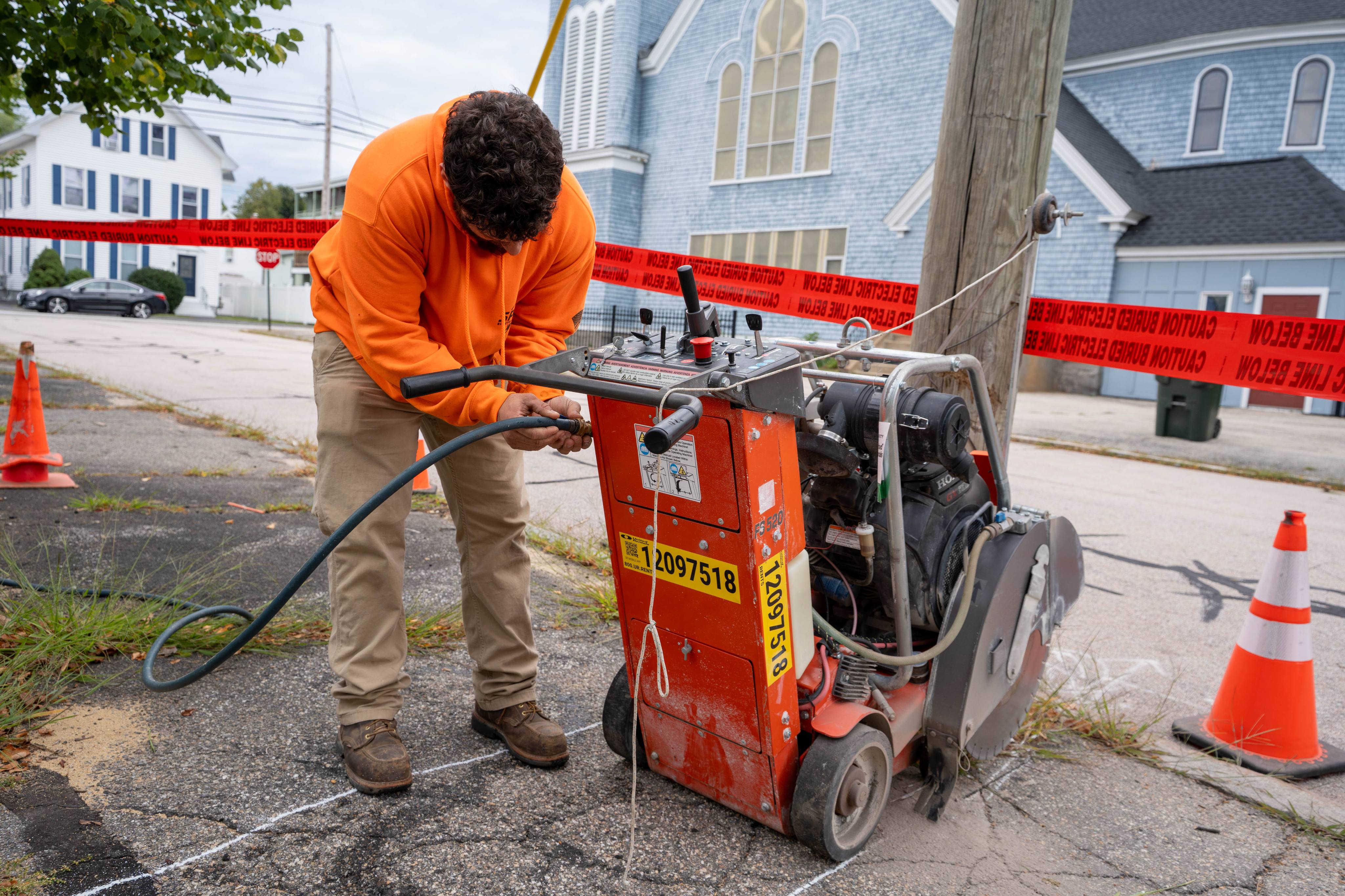 Saw-cutting pavement for the new underground electrical service